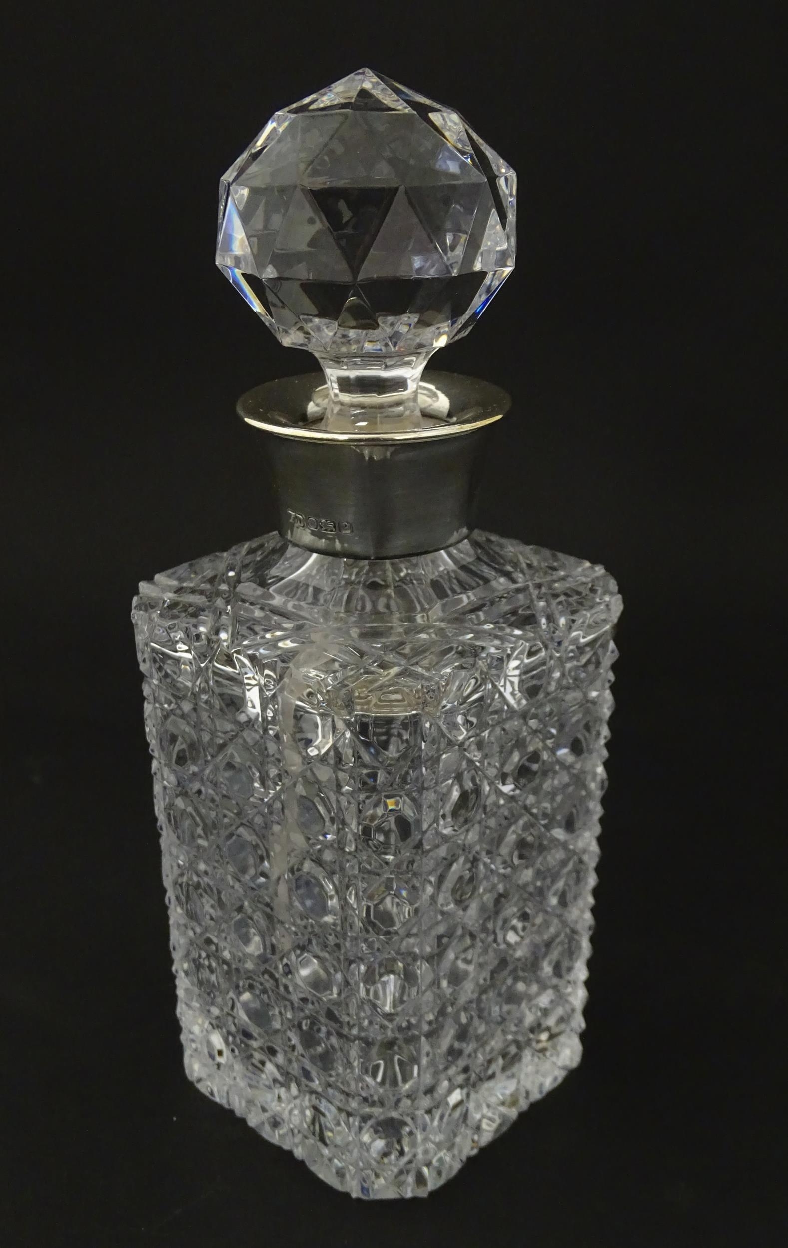 A cut glass decanter with silver collar hallmarked Sheffield 1989 maker F Drury Ltd. Approx 9 1/2" - Image 3 of 8