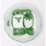 An Art glass dish, the white ground with green abstract detail. Signed with monogram. Approx 4 1/