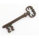 A 20thC novelty corkscrew / bottle opener modelled as an old key, titled The Key to Happiness. In