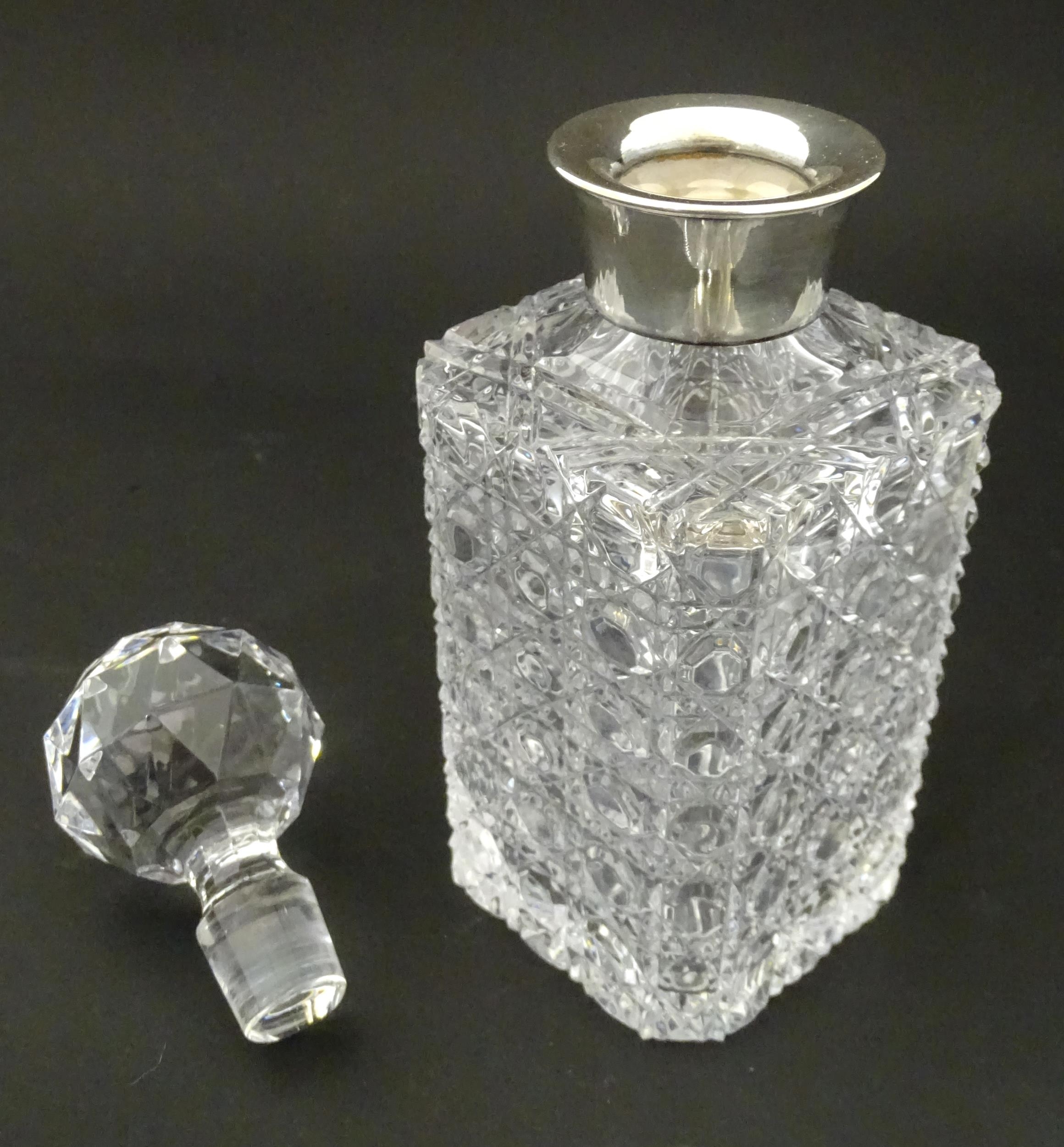 A cut glass decanter with silver collar hallmarked Sheffield 1989 maker F Drury Ltd. Approx 9 1/2" - Image 5 of 8