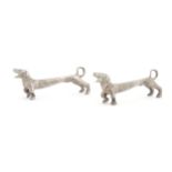 A pair of 20thC novelty knife rests modelled as dachshund dogs. Approx. 3" wide (2) Please Note - we