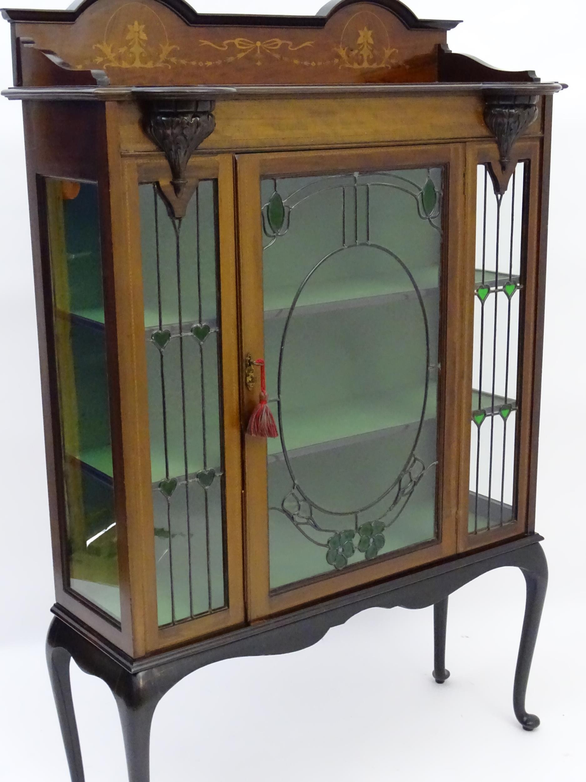 An Edwardian mahogany display cabinet with leaded glass panelling, stained glass panels and a - Image 9 of 12