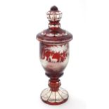 A Victorian Bohemian ruby red and clear glass vase and cover with etched stag / deer in landscape