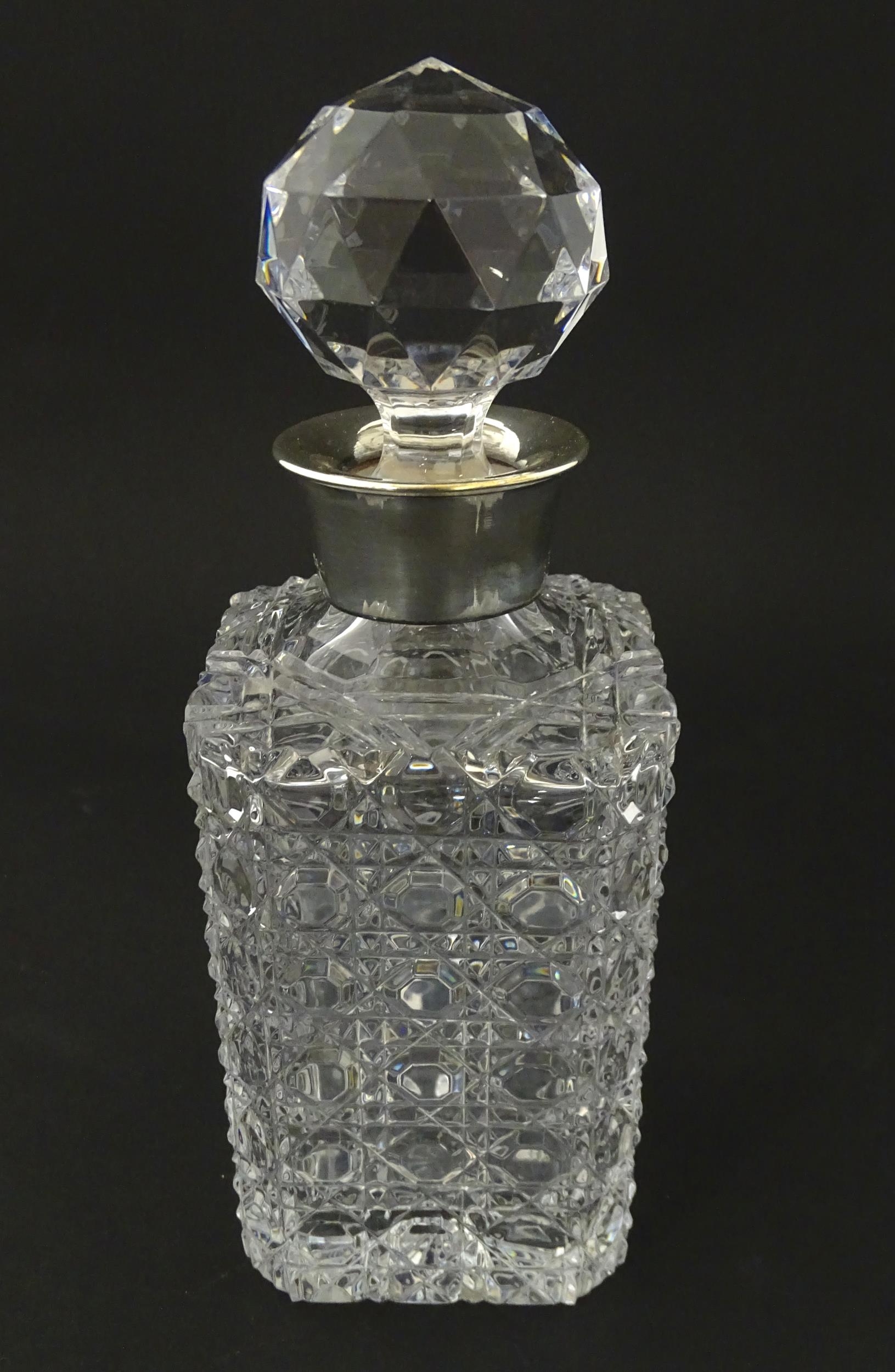 A cut glass decanter with silver collar hallmarked Sheffield 1989 maker F Drury Ltd. Approx 9 1/2" - Image 4 of 8