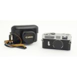 A cased Canon Model 7 rangefinder camera body Please Note - we do not make reference to the