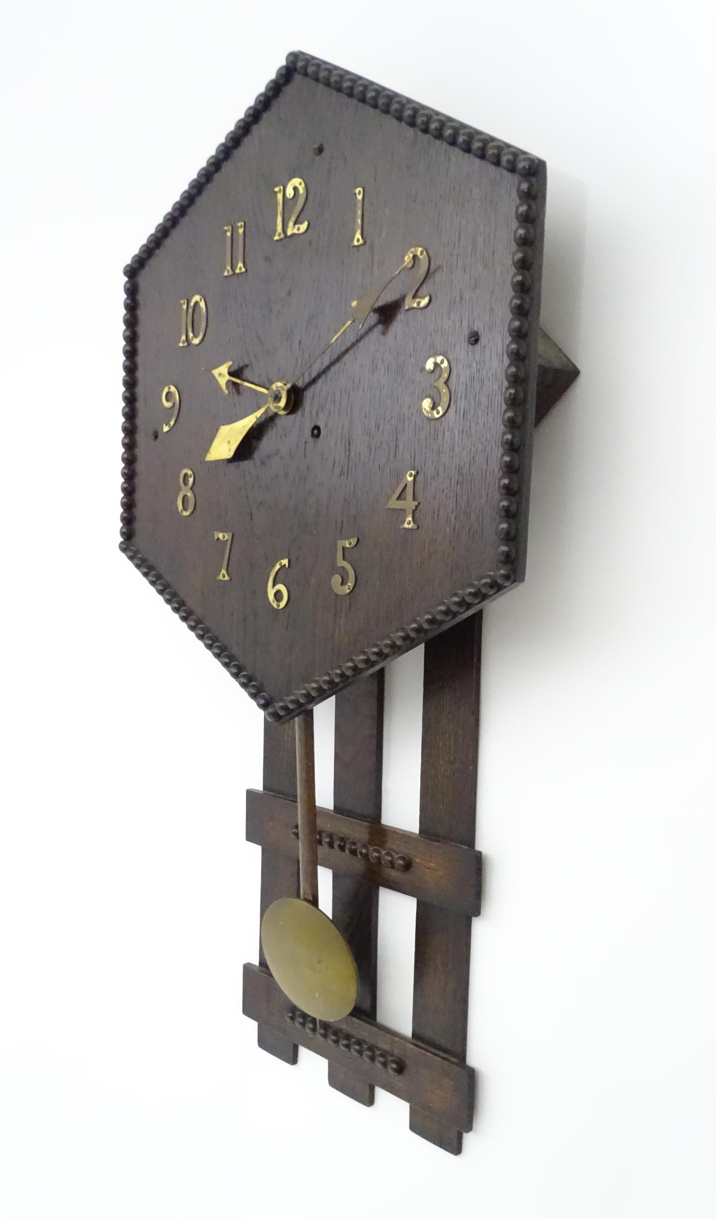 An Arts and Crafts style oak wall clock, the hexagonal dial with Arabic brass numerals and - Image 4 of 9