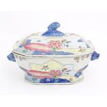 A Chinese export famille rose lidded tureen decorated in the tobacco leaf pattern with flowers and