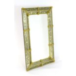 A late 20thC Venetian style mirror of rectangular form with applied floral glass detailing and