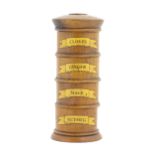 A four tier treen spice tower labelled Cloves, Ginger, Mace, and Nutmeg. Approx. 7 1/2" high