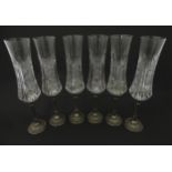 A set of six Italian cut glass champagne flutes raised on pewter stem and foot. Approx 11" high (