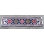 Carpet / Rug : A North West Persian Heriz Runner with blue ground having central medallions and
