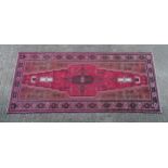 Carpet / Rug : A North East Persian meshed Belouch rug Approx. 120" x 51" Please Note - we do not
