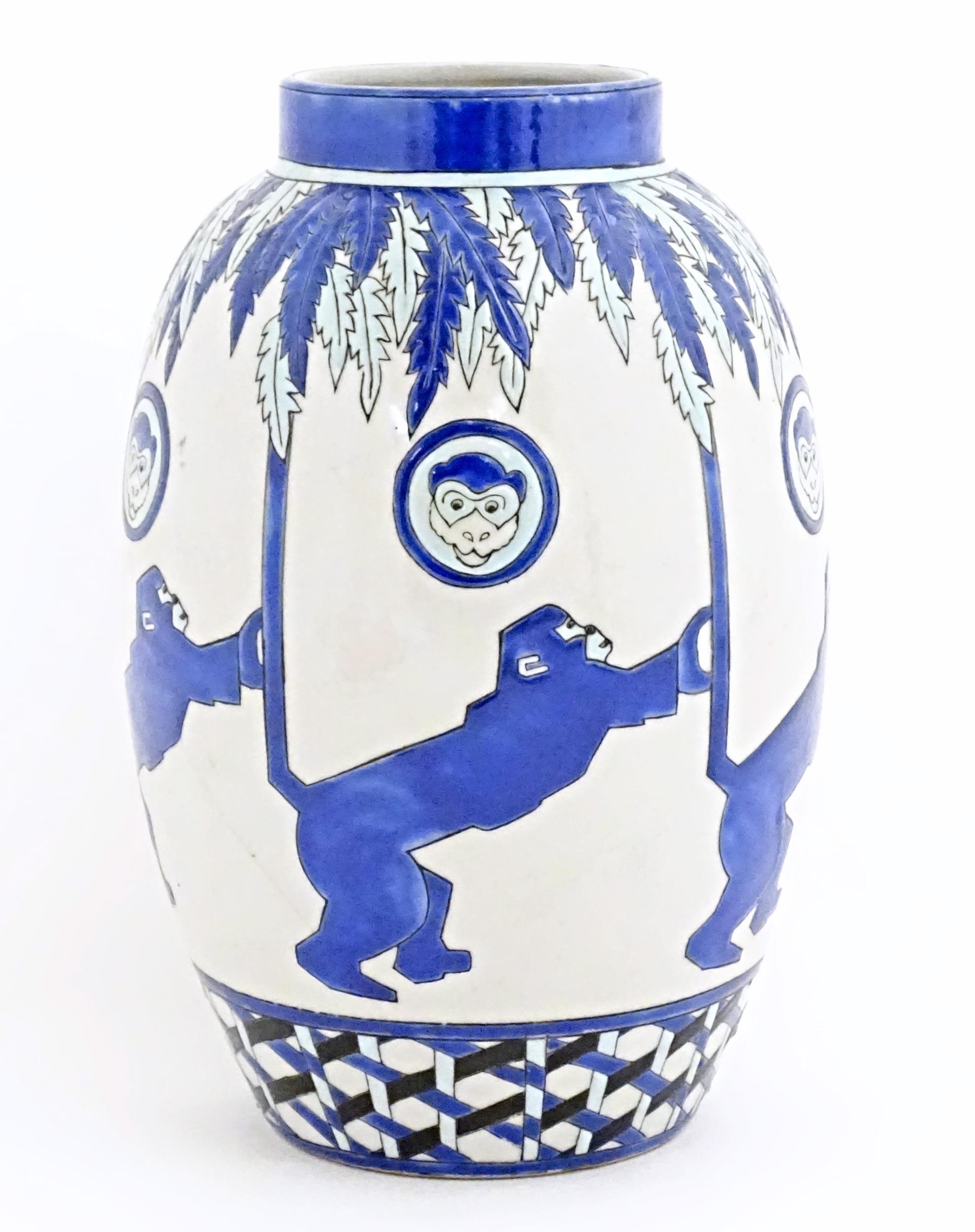 An Art Deco style blue and white vase decorated with banded monkey and palm tree detail. Marked - Image 4 of 8