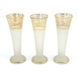 Three retro glass vases with textured body and gilt banding. Approx 8 1/2" high Please Note - we