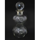 A glass decanter with silver collar hallmarked Birmingham 1911 maker Mappin & Webb and numbered