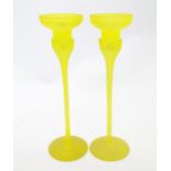 A pair of retro yellow art glass candlesticks. Approx 10 1/2" high (2) Please Note - we do not
