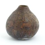 Ethnographic / Native / Tribal: An African gourd vase with incised animal decoration and banded