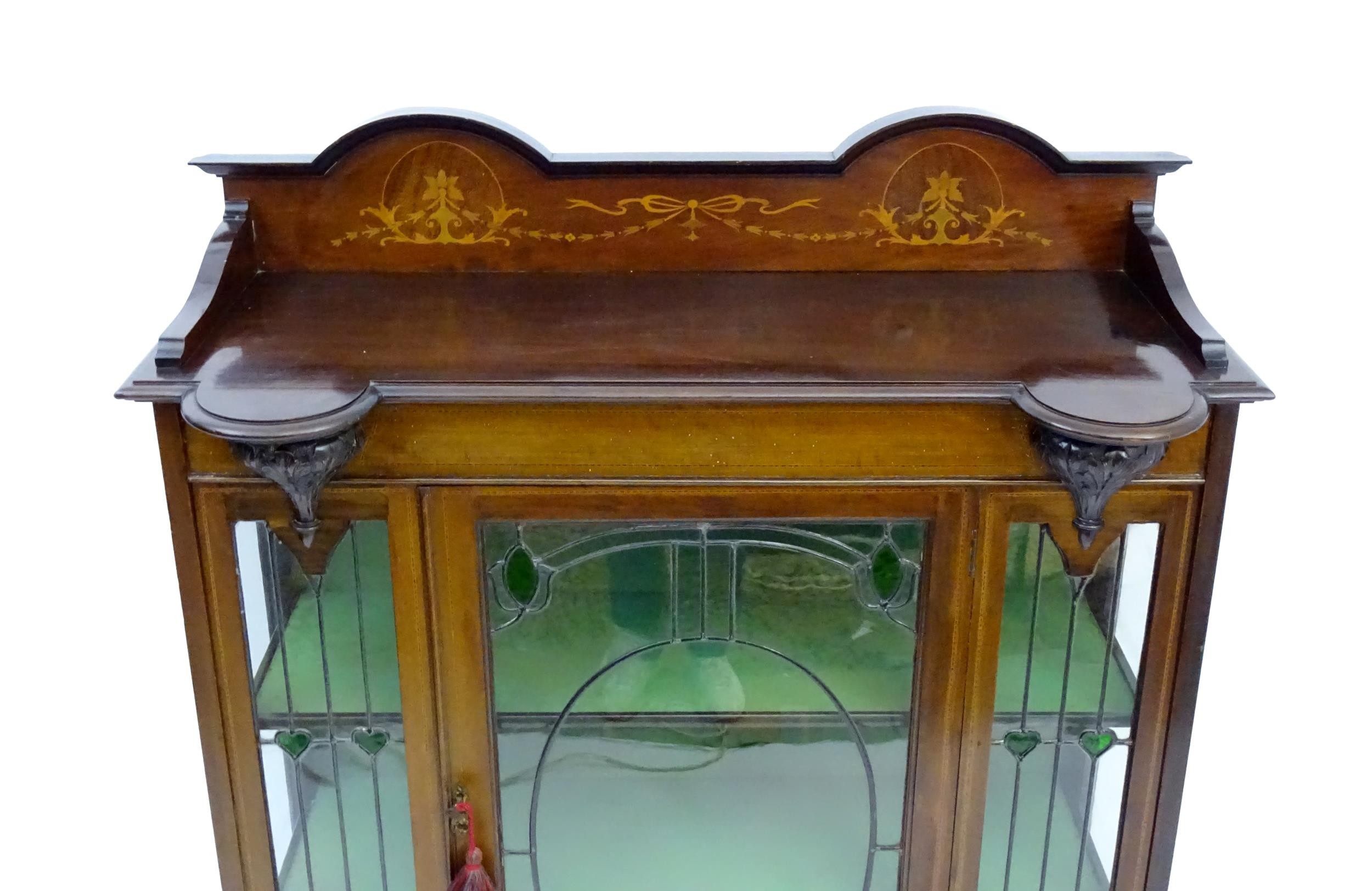 An Edwardian mahogany display cabinet with leaded glass panelling, stained glass panels and a - Image 6 of 12