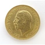 Coin : A George V 1929 gold sovereign coin. Total weight approx. 8g Please Note - we do not make