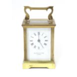A late 20thC brass cast carriage clock, signed Mappin and Webb, London. Approx. 6 1/2" high