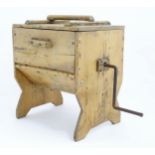 A 19thC pine butter churn, with iron crank handle rotating paddles to the interior. Standing