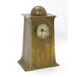 A German Jugendstil / Secessionist brass mantel clock with convex glass to front and domed top.