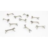 A quantity of 20thC Continental novelty knife rests modelled as animals to include ram, pig, bear,