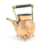 An Arts & Crafts copper and brass spirit kettle designed by Christopher Dresser for Benham &