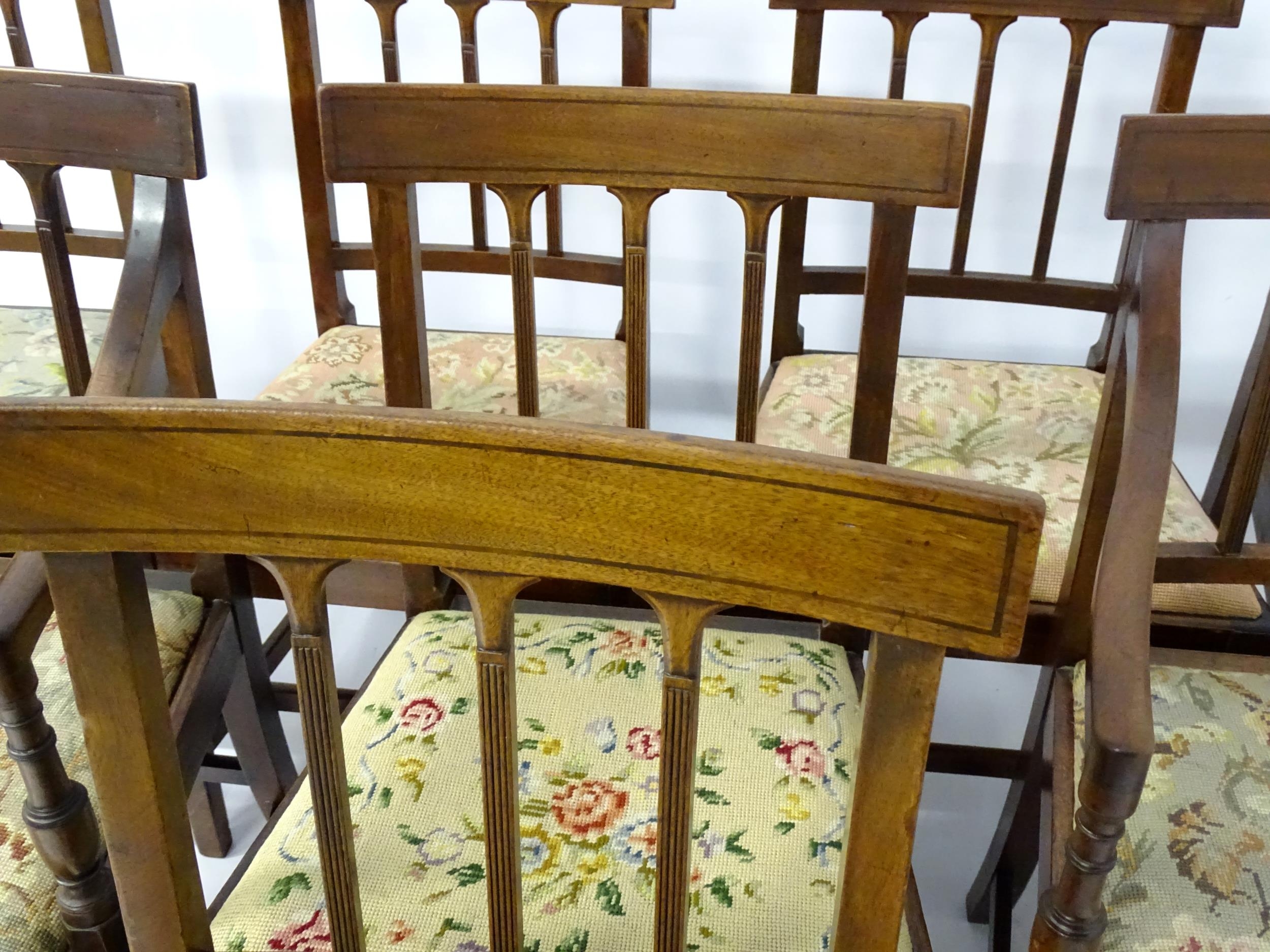 A set of eight Georgian mahogany dining chairs, having inlaid top rails above reeded back splats and - Image 8 of 12
