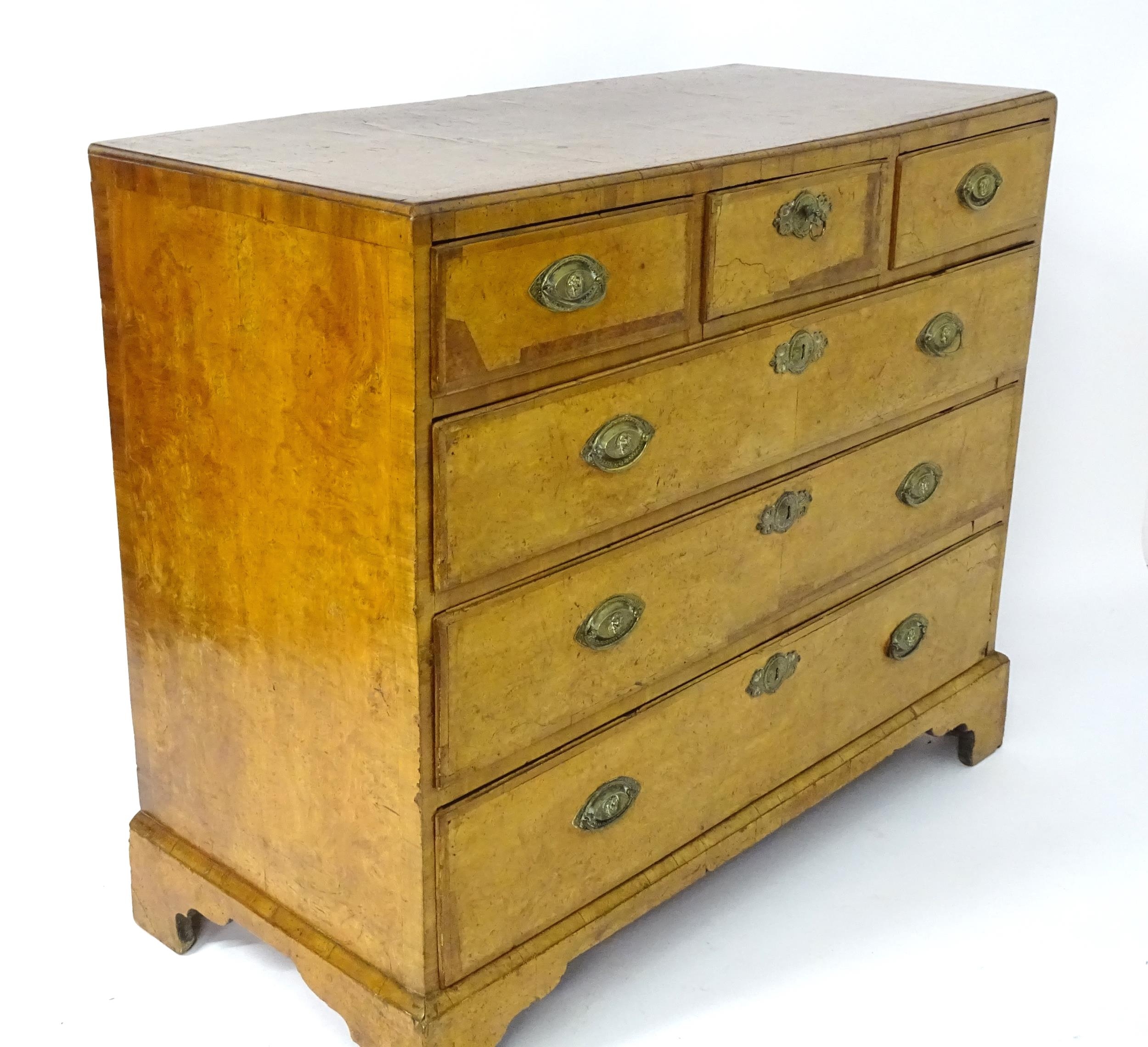 A George III walnut chest of drawers, the chest having a crossbanded top above three short over - Image 3 of 12
