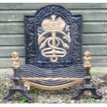 A cast iron fire back of arched form with relief decoration depicting CR crown, anchor and rope,