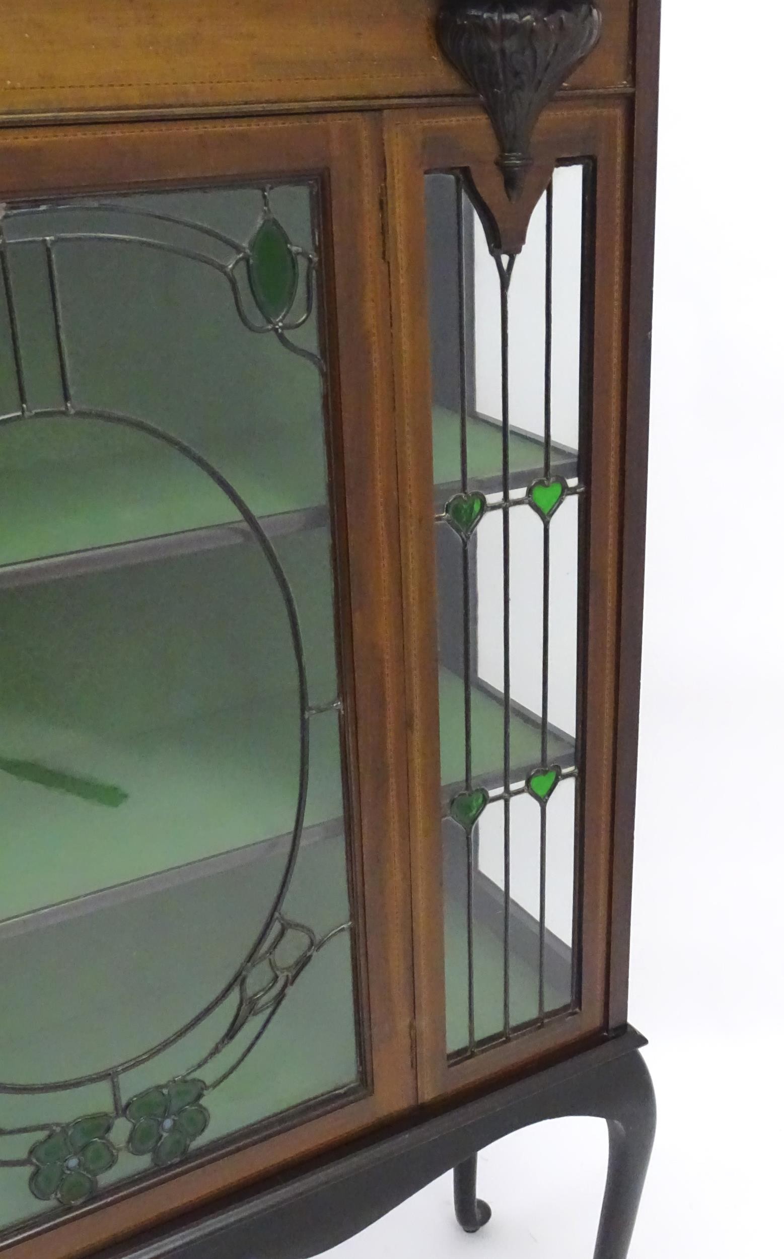 An Edwardian mahogany display cabinet with leaded glass panelling, stained glass panels and a - Image 10 of 12