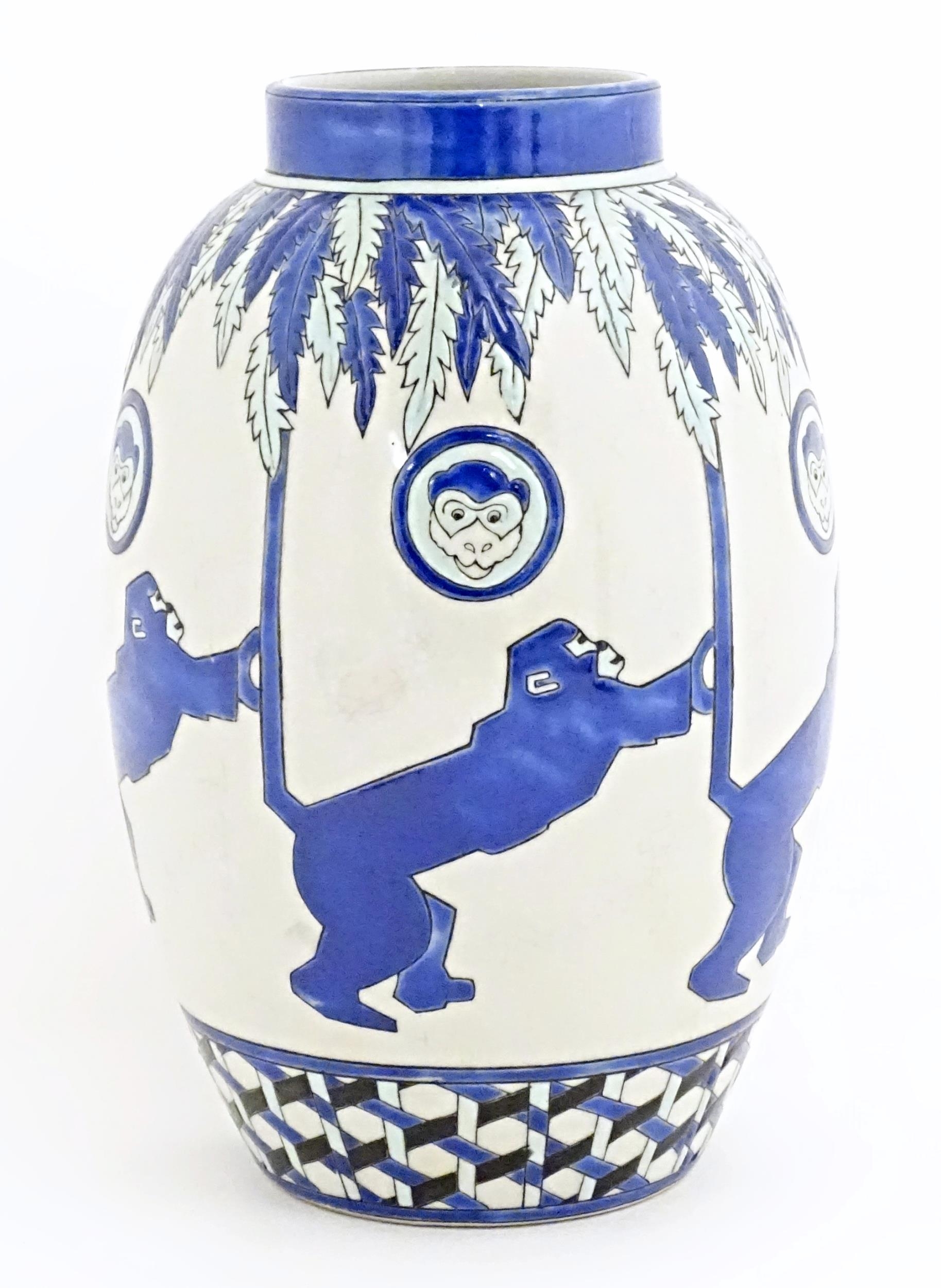 An Art Deco style blue and white vase decorated with banded monkey and palm tree detail. Marked - Image 6 of 8