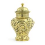 A Chinese cast brass vase and cover of baluster form with relief decoration depicting dragons and