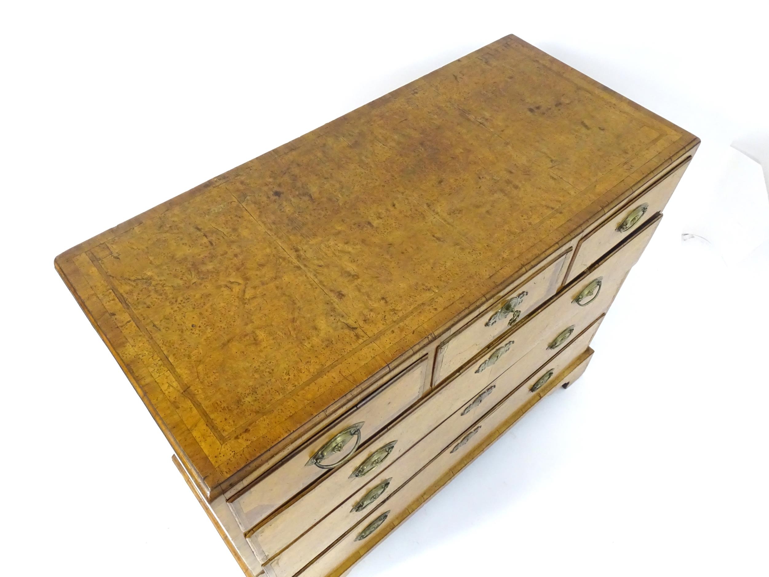 A George III walnut chest of drawers, the chest having a crossbanded top above three short over - Image 5 of 12