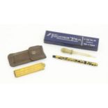 An early to mid 20thC fountain pen, with pierced gold plated barrel and 14ct gold nib, cased with