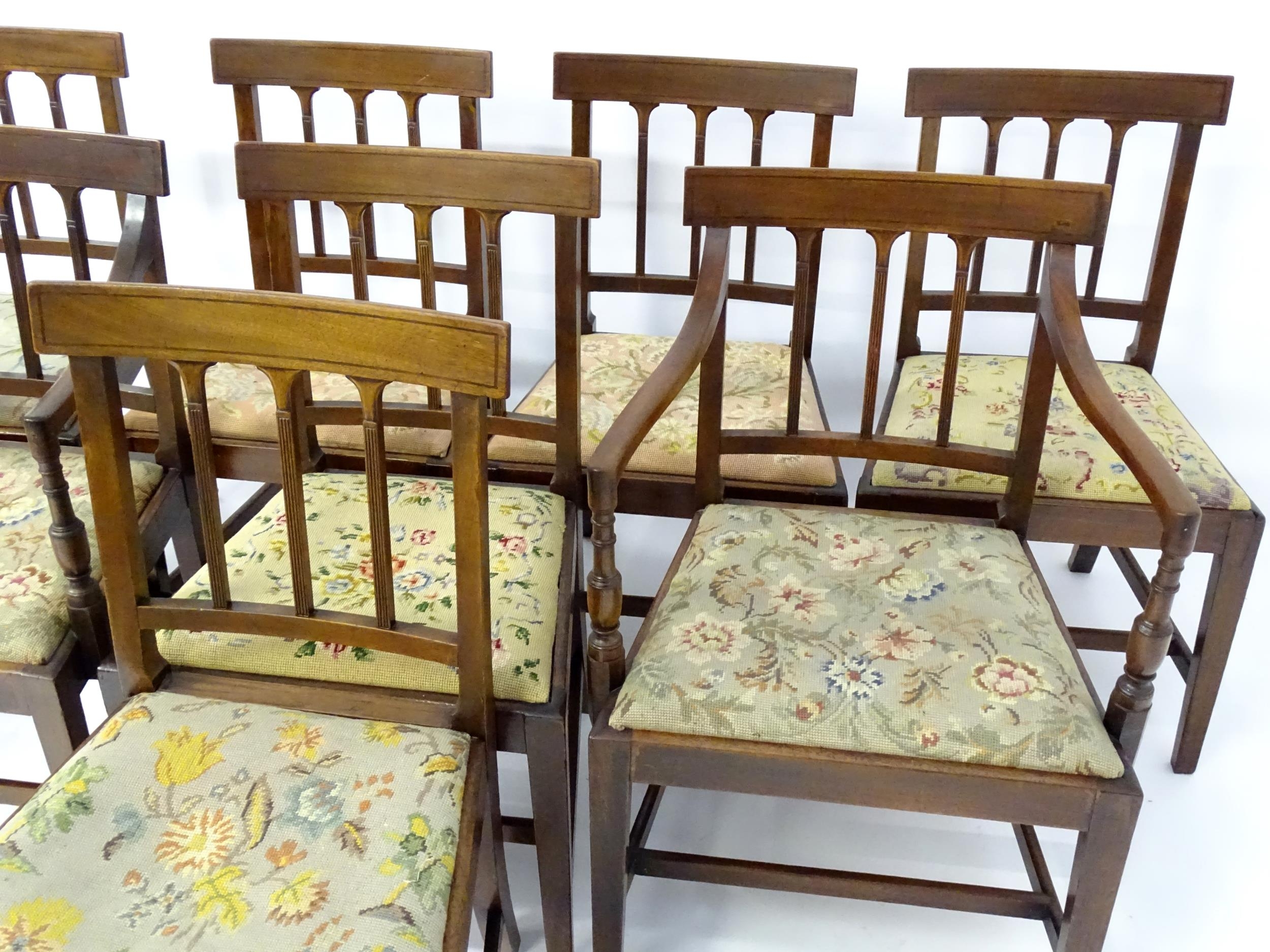 A set of eight Georgian mahogany dining chairs, having inlaid top rails above reeded back splats and - Image 6 of 12