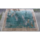 Carpet / Rug : A Chinese Art Deco style carpet, the green ground with beige border decorated with