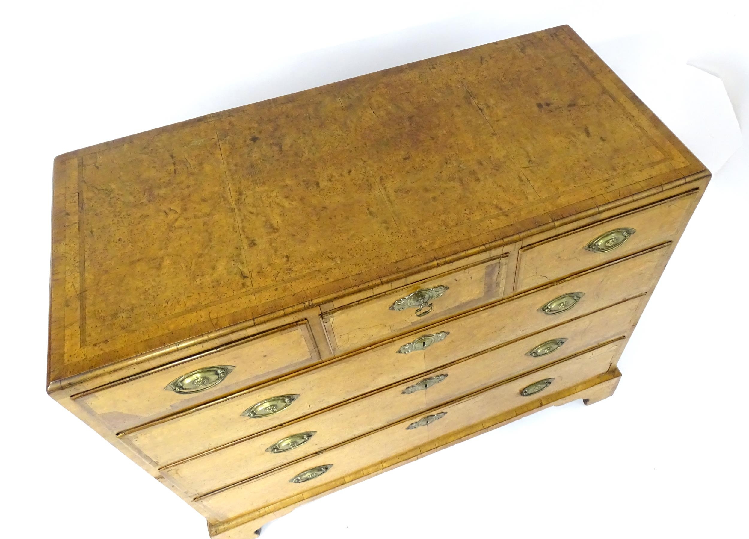 A George III walnut chest of drawers, the chest having a crossbanded top above three short over - Image 7 of 12
