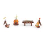Four Oriental agate models of musical instruments to include lute, quqin, etc. with wooden stands.