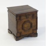A late 17thC / early 18thC oak box with a hinged lid above a geometric moulded front and raised on