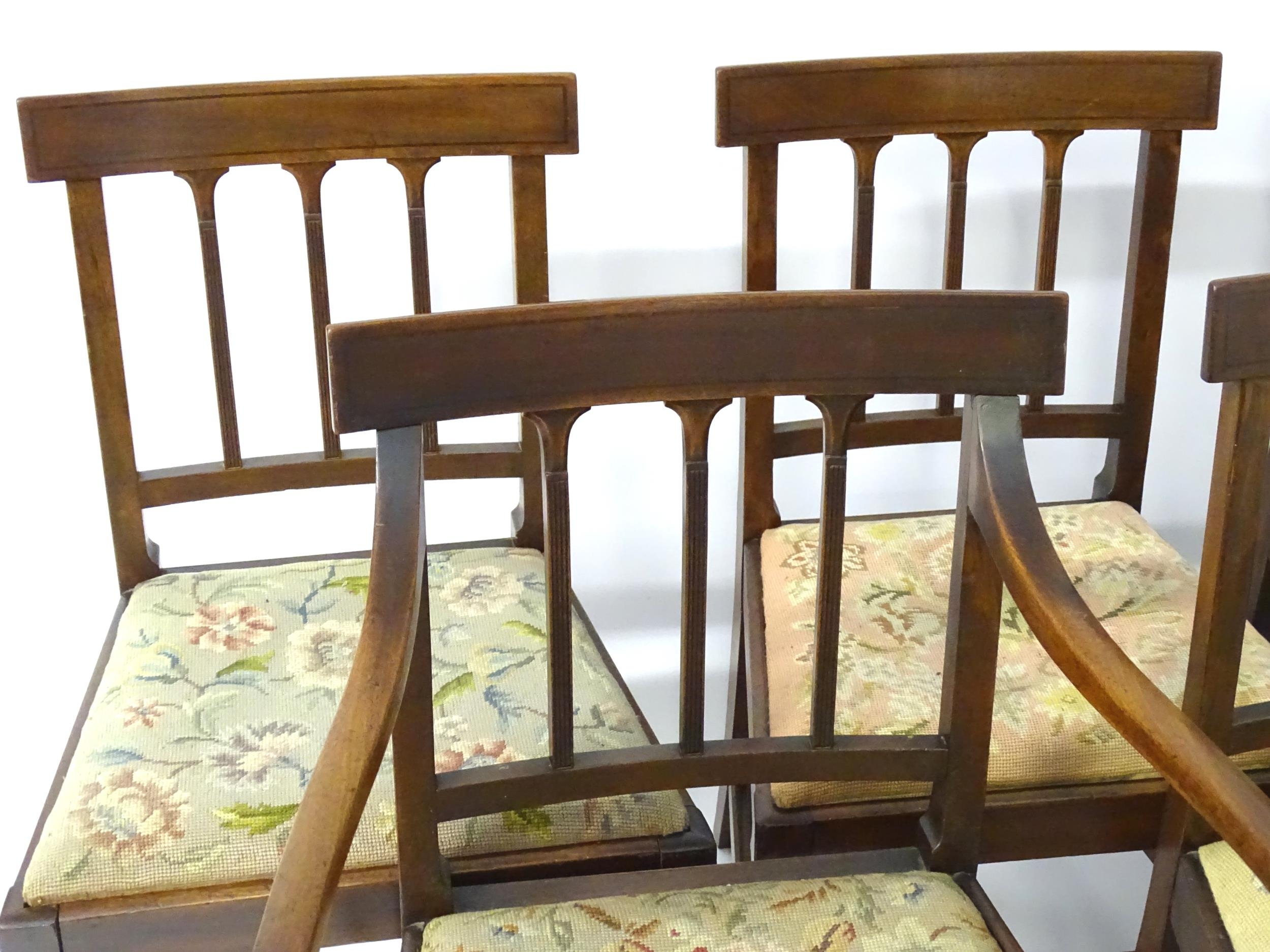 A set of eight Georgian mahogany dining chairs, having inlaid top rails above reeded back splats and - Image 5 of 12