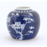 A Chinese blue and white jar decorated with blossom flowers. Ring mark under. Approx. 3 3/4" high