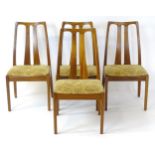 Vintage / Retro: A set of four teak Nathan dining chairs, having two shaped back splats and raised