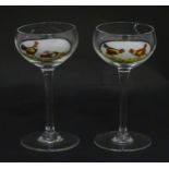 Two pedestal drinking glasses with hand painted cock fighting decoration. Approx. 5 1/2" high (2)