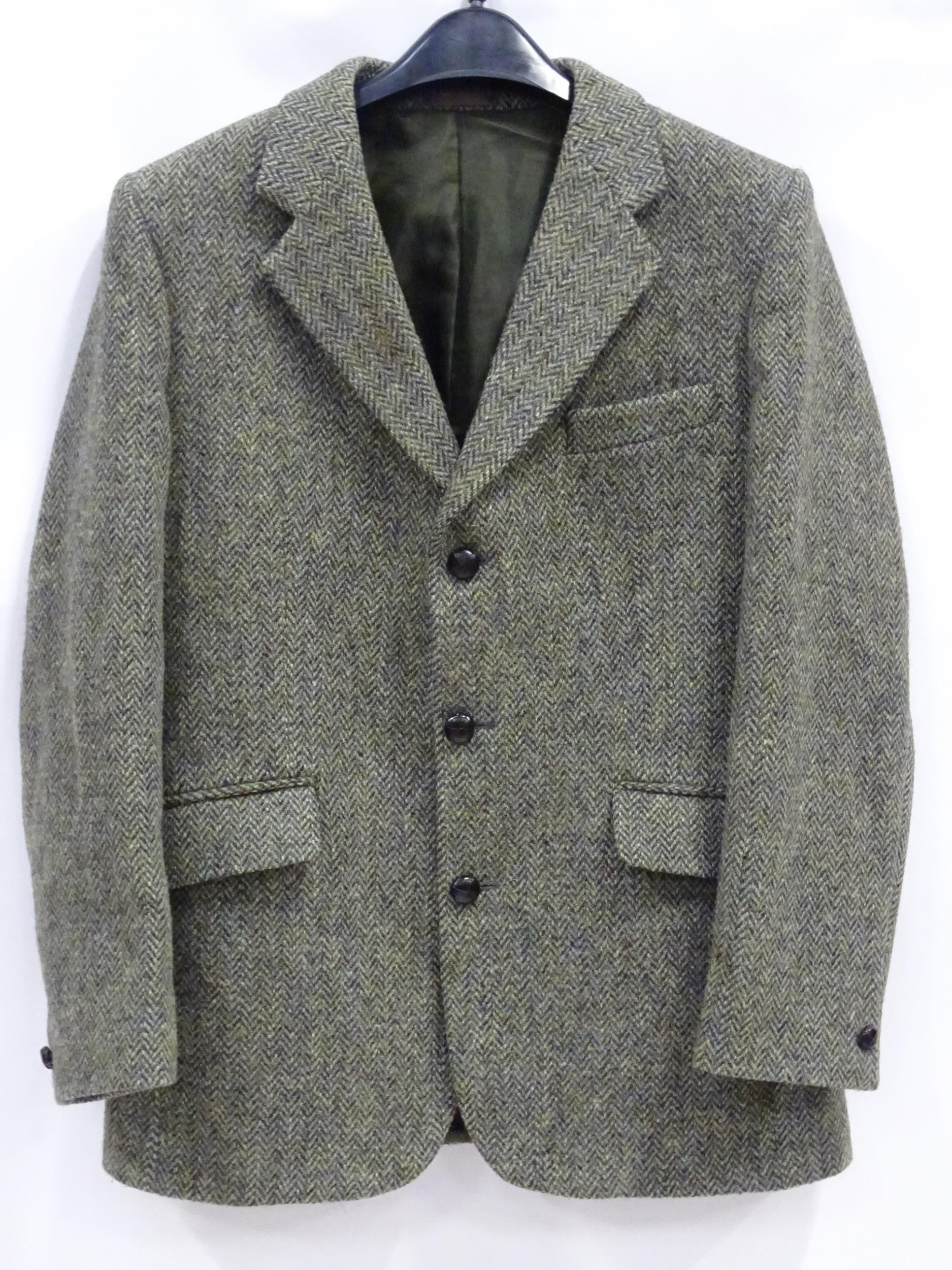 A Harris Tweed hacking jacket by Gurtex, with three buttons to front and single vent to rear,