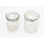A glass dressing table / toilet jar with silver lid, together with a glass hair tidy with a silver