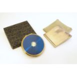 A Stratton powder compact with blue and gilt finish with a Stratton box, approx 3 1/4" diameter.