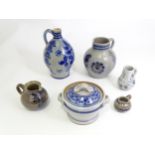 A quantity of German salt glazed stoneware items to include a wine jug / ewer with blue painted