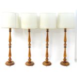 Four turned wooden standard lamps Approx. 64" high overall (4) Please Note - we do not make